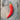 One large red Aji de Colorado Alpino chilli on a wooden table