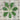 Kale leaves arranged in a circular pattern on a wooden surface